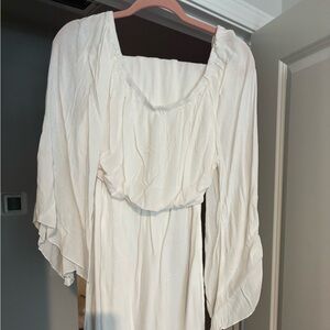 White Two Piece Set. Off the shoulder top and pants bottoms with slits.